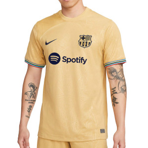 /D/J/DJ7675-715_camiseta-color-z-oro-nike-2a-barcelona-2022-2023-dri-fit-stadium_1_completa-frontal.jpg